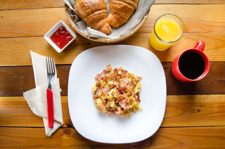 Traditional breakfast: scrambled eggs with hamの写真素材
