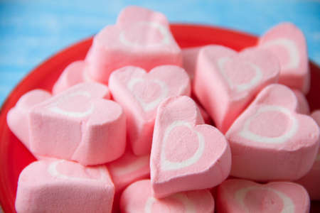 Pink heart marsmallow on plateの写真素材