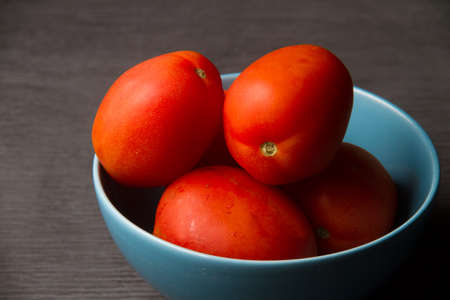 Red tomatoes in bowlの写真素材
