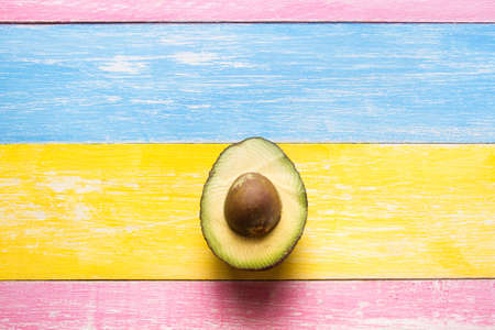 Avocado half on colorful backgroundの写真素材