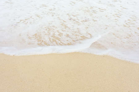 Sand and wave close upの写真素材