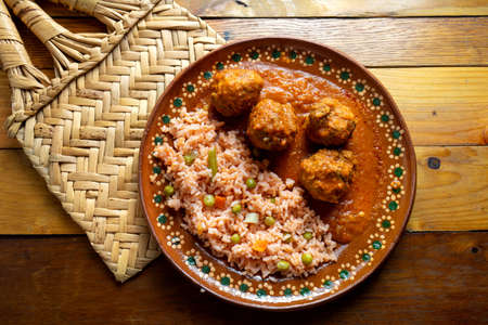 Traditional mexican meatballs with red rice