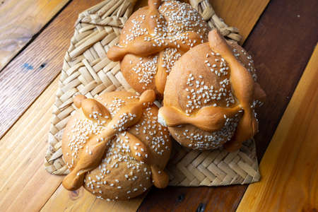 Traditional mexican bread of the dead on wooden table