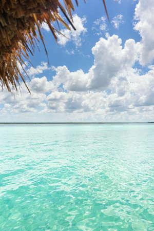 Turquoise lagoon view and palapa