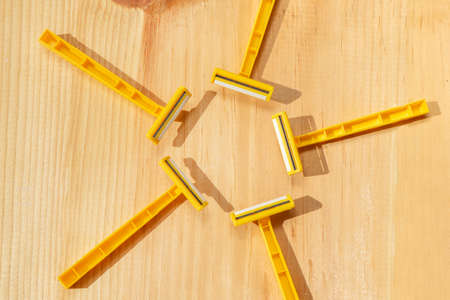 Yellow plastic shaving razor
