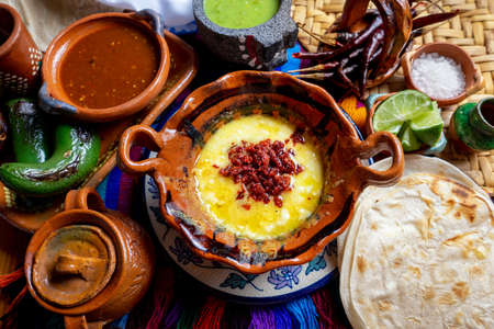 Authentic mexican melted cheese "melted" with red chorizoの写真素材