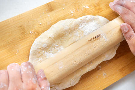 Young woman hands kneading
