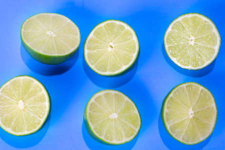 Fresh green limes on colorful backgroundの写真素材
