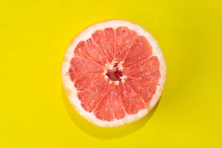 Fresh grapefruit on colorful backgroundの写真素材