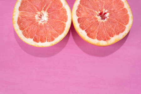 Fresh grapefruit on colorful backgroundの写真素材
