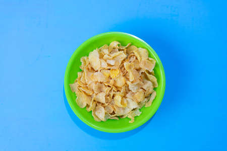 Corn flakes cereal breakfast on colorful background