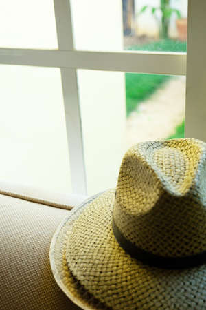 Tranquil scene with hat at the window