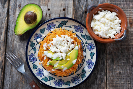 Tasty mexican noodles dry soup with avocado and cheeseの写真素材