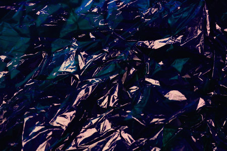 Blue wrinkled cellophane paper background textureの写真素材