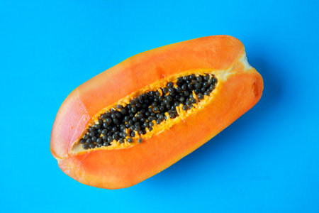 Half of tasty and juicy papaya with seedsの写真素材