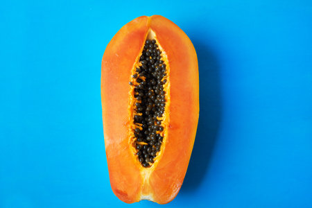 Half of tasty and juicy papaya with seedsの写真素材