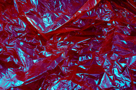 Pink wrinkled cellophane paper background textureの写真素材