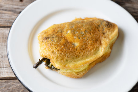 Traditional mexican stuffed chili pepper "filled" on wooden backgroundの写真素材