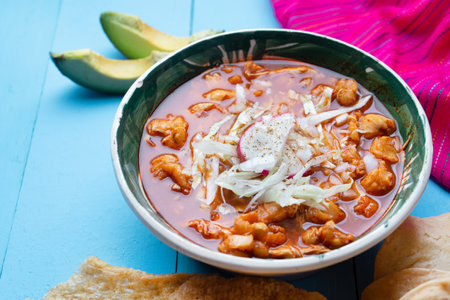 Traditional mexican red pozole soup on blue backgroundの写真素材