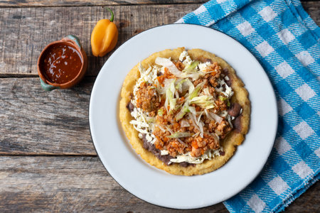 Traditional mexican food: sopes of Picadillo beef with cheese and beansの写真素材