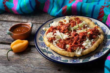 Traditional mexican food: sopes of Chorizo with cheese and beansの写真素材