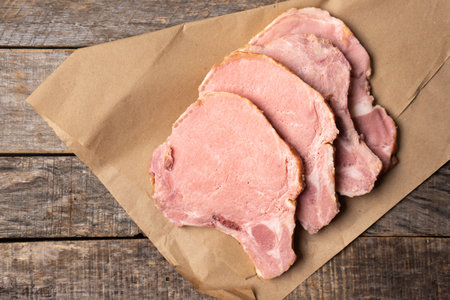 Raw smoked pork chops on wooden backgroundの写真素材