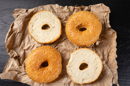 Traditional sesame bagels on dark background