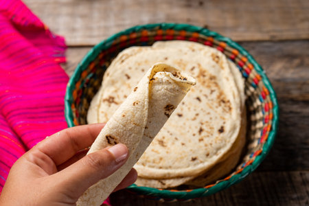 Traditional mexican corn tortillas on wooden background