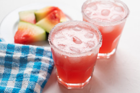 Traditional mexican watermelon margarita cocktail on white backgroundの写真素材