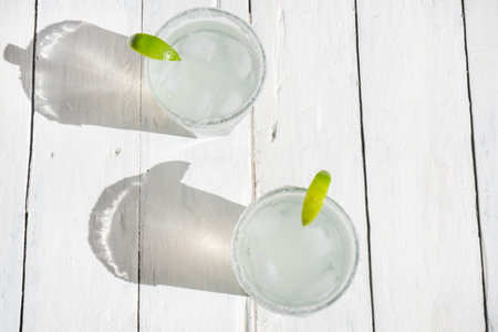 Traditional mexican lime margarita cocktail on white backgroundの写真素材