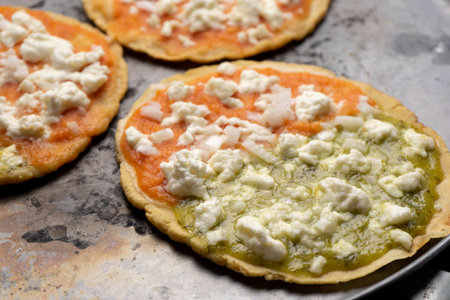Traditional mexican memela with green and red sauce on dark background