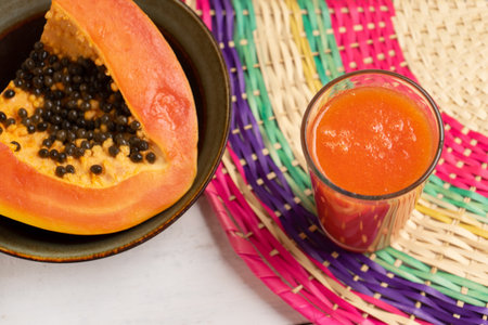 Fresh papaya juice drink on white backgroundの写真素材