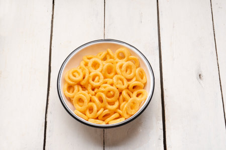 Rings of fried wheat is a traditional mexican snack on white backgroundの写真素材