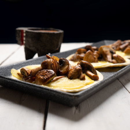 Traditional mexican quesadillas with mushrooms on white backgroundの写真素材