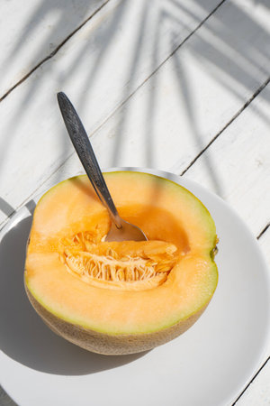Sweet muskmelon fruit on white backgroundの写真素材