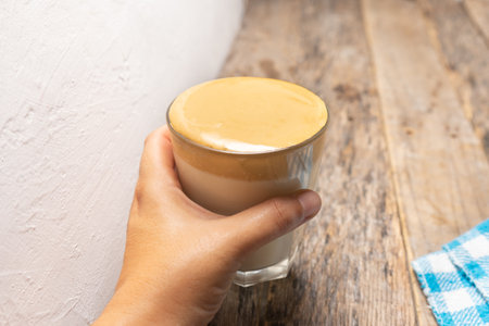 Traditional korean dalgona coffee on wooden backgroundの写真素材