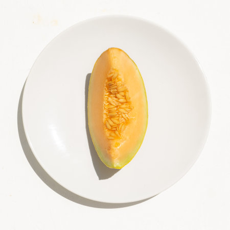 Sweet muskmelon fruit on white background