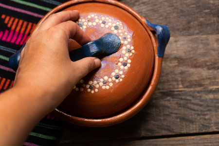 Traditional mexican clay pot also called cazuela on wooden background