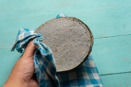 Traditional mexican blue corn tortilla on turquoise backgroundの写真素材
