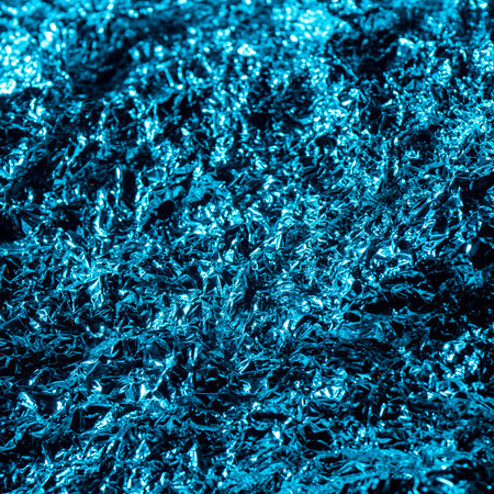 wrinkled and sparkly blue background textureの写真素材
