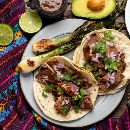 Traditional grilled beef steak tacos on wooden background. Mexican foodの写真素材