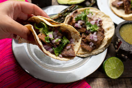 Traditional grilled beef steak tacos on wooden background. Mexican foodの写真素材