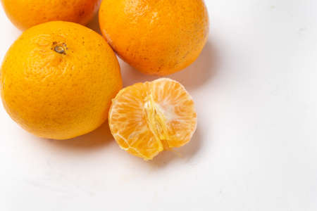 Fresh orange fruit on white backgroundの写真素材