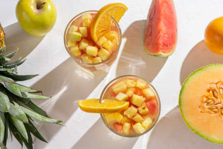 Cold sangria cocktail with white wine and fresh fruitの写真素材