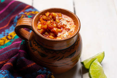 Traditional red corn esquites on white background. Mexican foodの写真素材