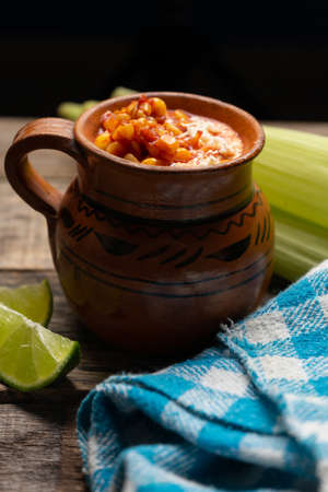 Traditional red corn esquites on wooden background. Mexican foodの写真素材