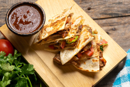 Grill steak mulitas with fresh sauce and cheese on wooden background. Traditional mexican foodの写真素材