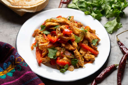 Traditional mexican food. Chicken fajitas on gray backgroundの写真素材
