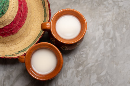 Traditional mexican fermented beverage called pulque on a gray backgroundの写真素材