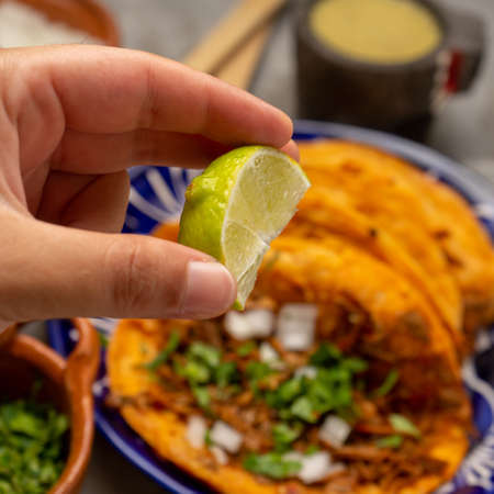Birria tacos on a gray background. Traditional mexican foodの写真素材